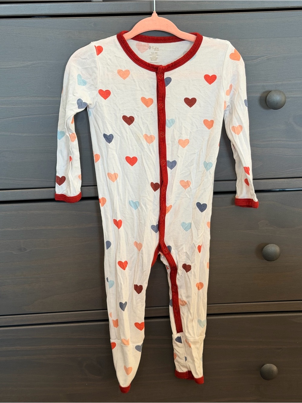 Kyte BABY White Romper with Red Trim and Multicolor Hearts